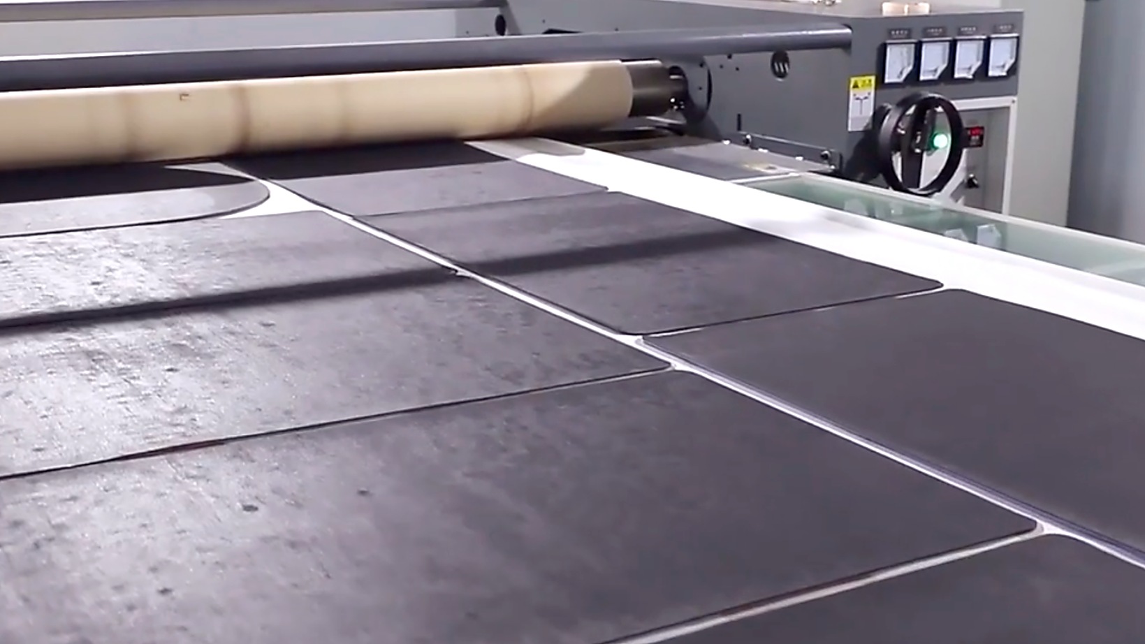 Diatomite mat sheets moving through processing equipment