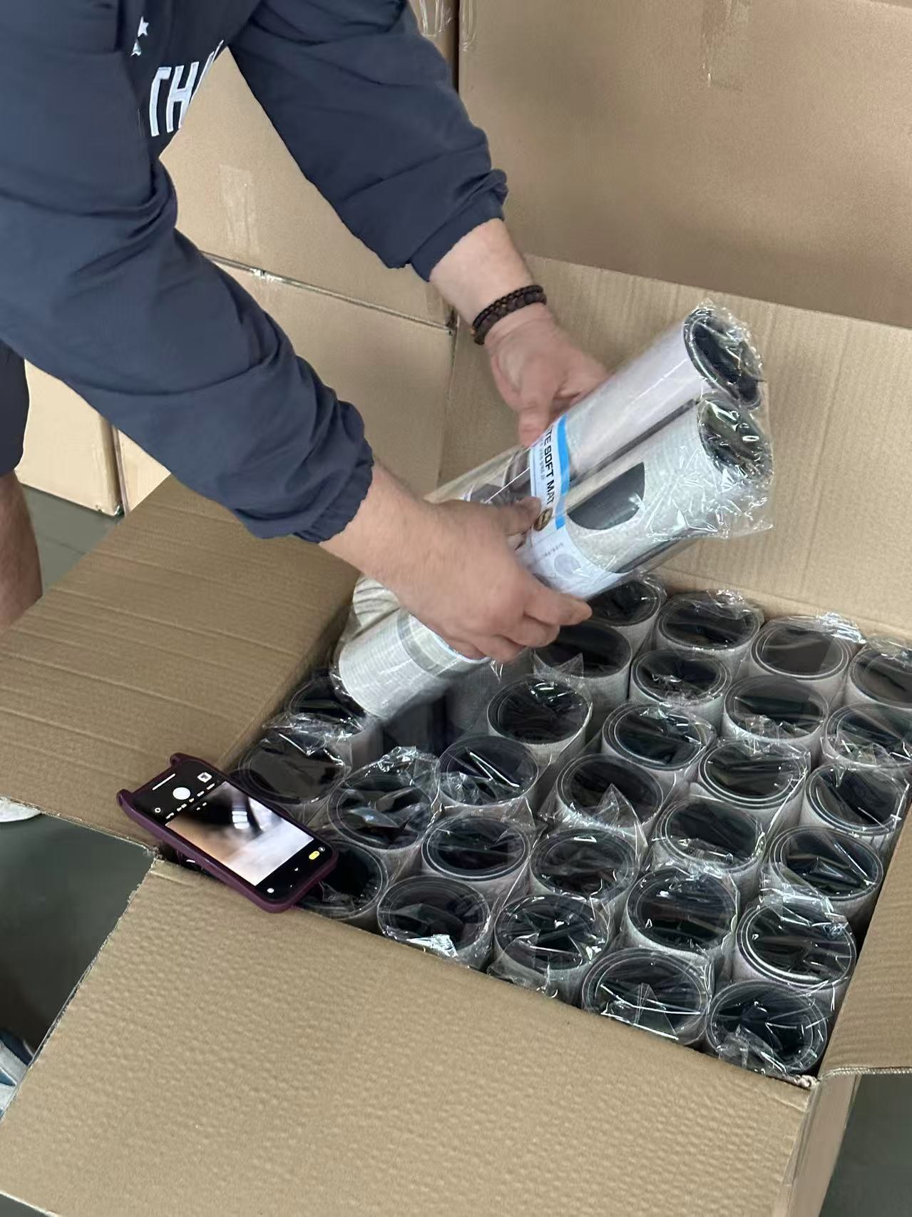 Worker packing finished mats